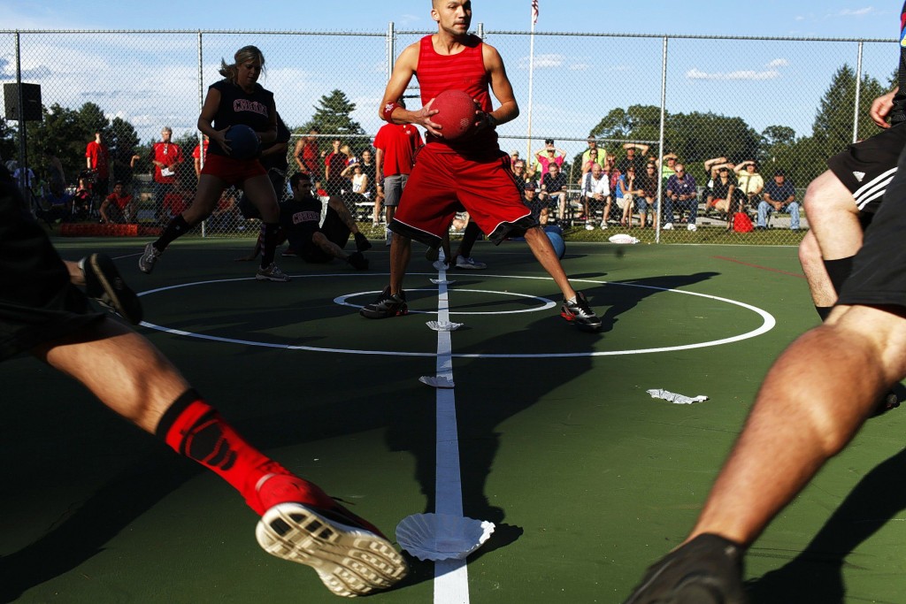TAEHOON KIMChristopher Griffin (center) of Concord grabs a ball during the dodge ball tournament at National Night Out at Rollins Park in Concord on Tuesday, Aug. 6, 2013. (TAEHOON KIM / Monitor staff)
