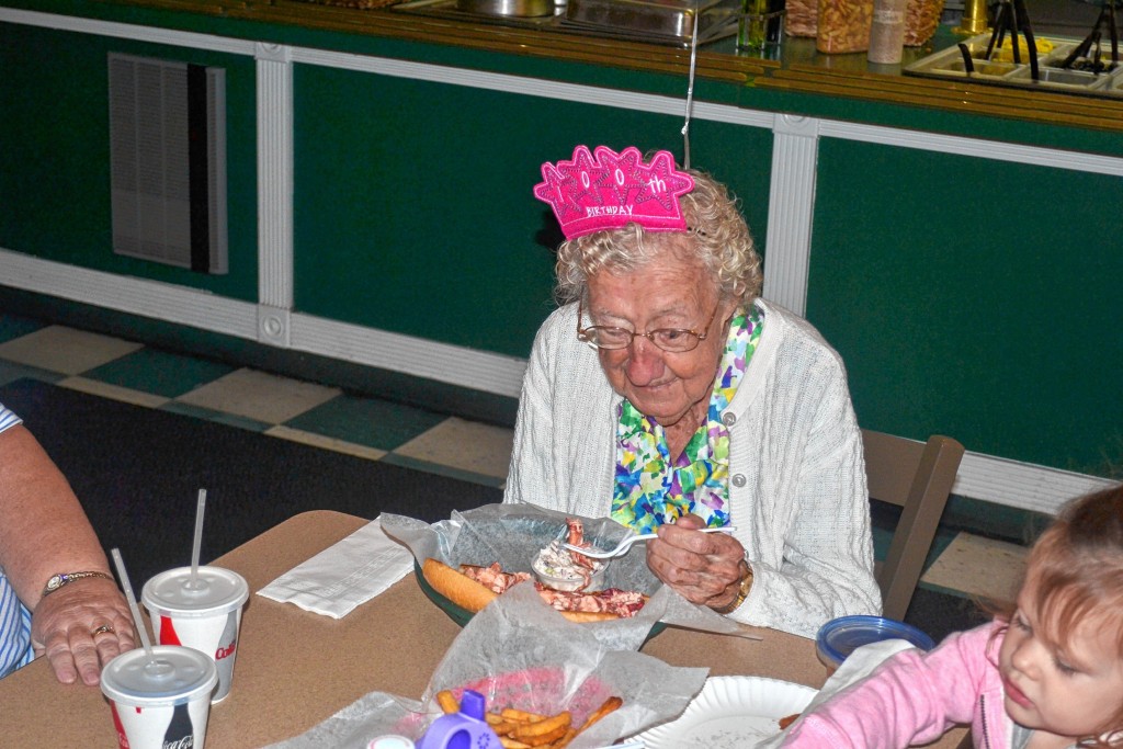 Tim Goodwin / Insider staffLeft: Nellie Mitchell gets ready to enjoy the first bite of her free birthday lobster roll at Constantly Pizza on Friday. Right: Mitchell’s life, by the numbers.