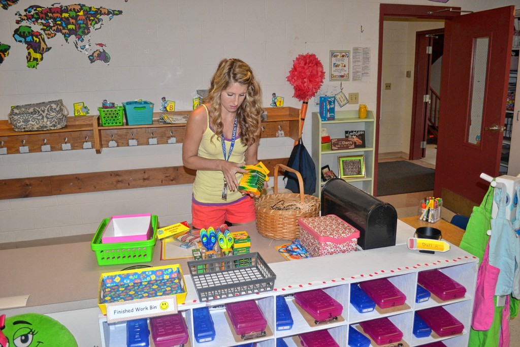 Tim Goodwin / Insider staffBow Elementary School first-grade teacher Brittany Galvin makes sure she has enough crayons to go around while setting up her classroom last week.