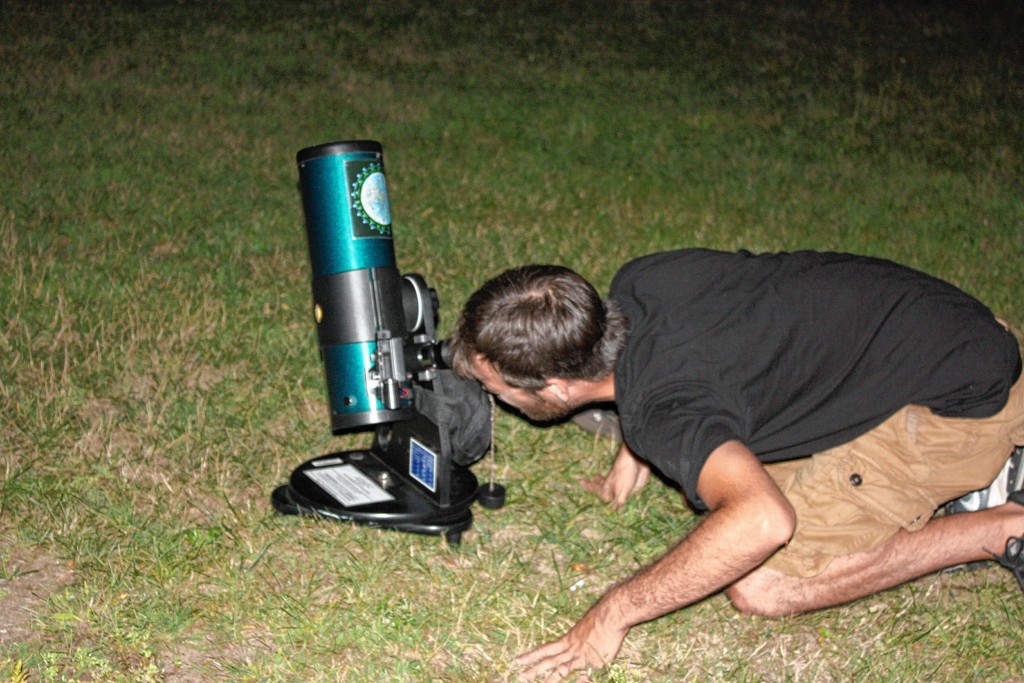 WILLIAM PERKINS / For the InsiderJon fiddles with Concord Public Library's telescope outside of the “Monitor” after a late shift.