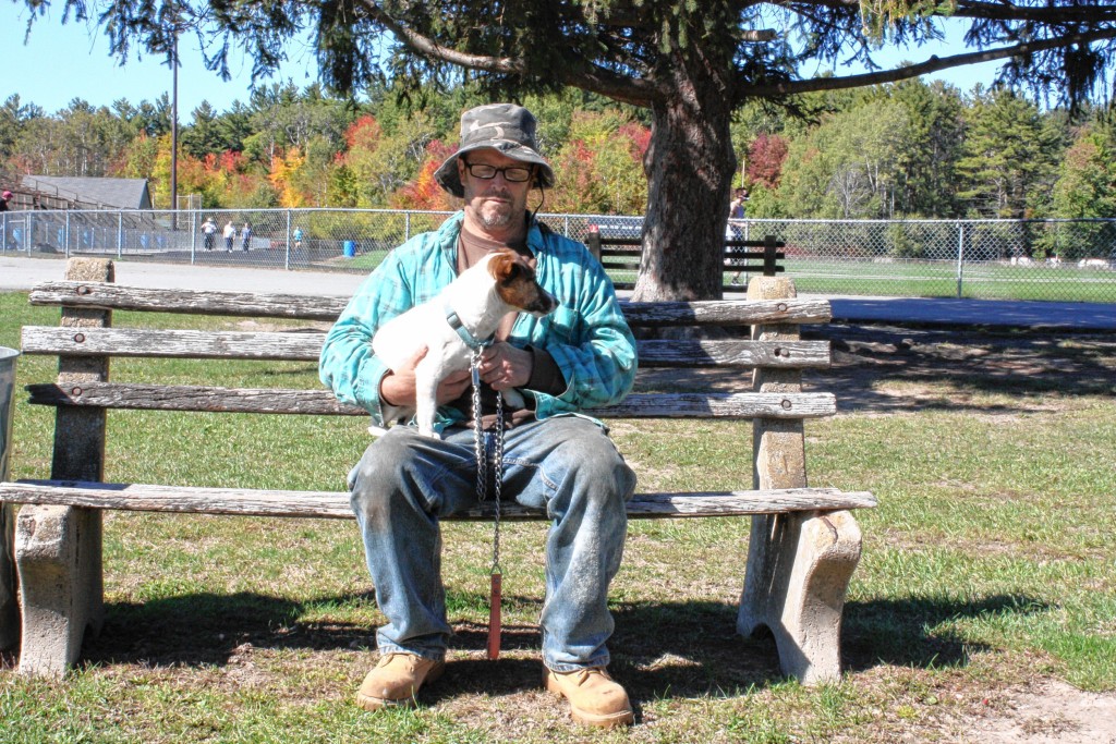 JON BODELL / Insider staffMike Wagner sits with his dog Buster at Memorial Field in Concord last week. Wagner was diagnosed with breast cancer in 2014, and he said he wouldn't have even known if not for Buster, who smelled the tumor and wouldn't leave Wagner alone until he got it taken care of.