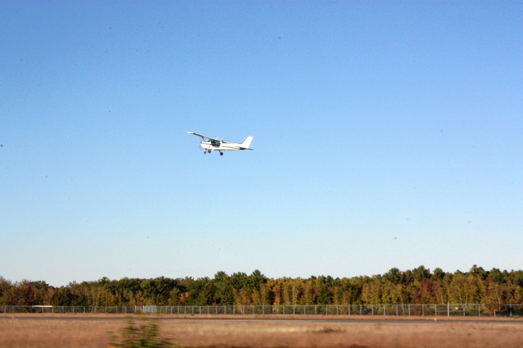 There are many things a pilot needs to do before taking off. There’s an extensive list of parts, gauges, fluids and functions that need to be checked every time a flight is planned, and it can be a fairly time-consuming process. Since we only have a limited amount of space on this page, we’ve summed it all up in five easy-to-remember steps. For a more detailed overview, find this story online at theconcordinsider.com. Step 1: Put gas in the plane. Here we see airport employee Grant Richardson adding 13.1 gallons of airplane gasoline to one of the plane’s wing tanks. You really don’t want to run out of gas when you’re thousands of feet above the ground. Step 2: Untie the plane, the way pilot Carole Gadois is doing here. It’s important to always secure the plane to the ground once it has landed – these things are meant to take flight, and a little gust of wind can send an aircraft a long way (which you don’t want) – and equally important to detach the tie-downs before attempting a takeoff. Failure to do so will keep you grounded. Step 3: Here’s where we really start to condense things. In this step, Gadois checks that no water has gotten mixed into the fuel. This is one of many pre-flight checklist items the pilot goes through before every takeoff. Since there are many, many steps in this process, we just showed you one of the more photogenic ones. Step 4: Build up speed across the runway until the plane can achieve liftoff. Here we see the point of “rotation,” which is the moment the front wheels come off the ground and the plane begins to take flight. The smaller and lighter the plane, the less runway is required to take off. Since this is quite a light aircraft, it was off the ground after only about 1,000 feet. Step 5: Pull up and start flying! From start to finish, Gadois nailed the routine perfectly and was flying like a pro in no time. Big thanks to her and airport manager Dave Rolla for letting us document the process from up close.