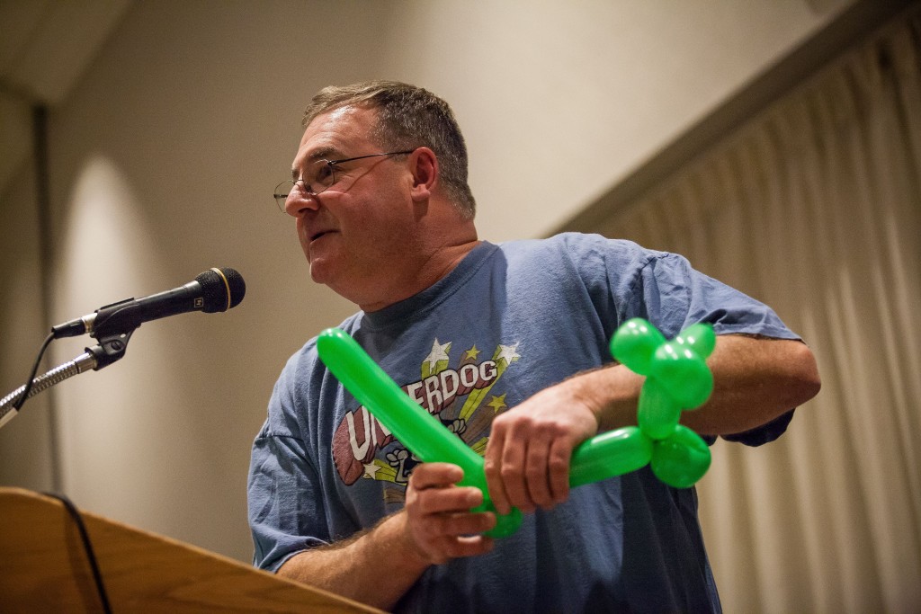 John Cimikowski, owner of Cimo's South End Deli, makes a balloon animal during the talent portion of the Mr. Concord Pageant at the Grappone Conference Center in Concord on Friday, Nov. 18, 2016. (ELIZABETH FRANTZ / Monitor staff)