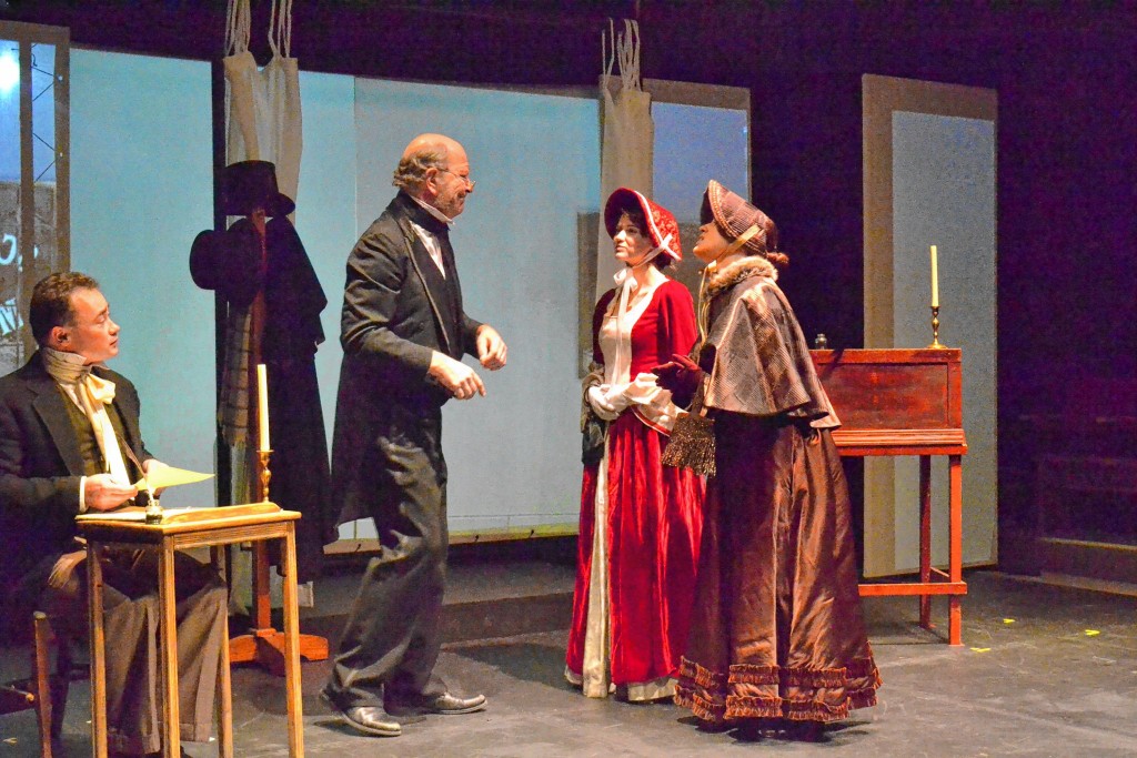 In the opening scene of Hatbox Theatre’s original adaptation of “A Christmas Carol,” Ebenezer Scrooge, played by Erik Peter Hodges, uses the classic “Bah humbug!” line to perfection.