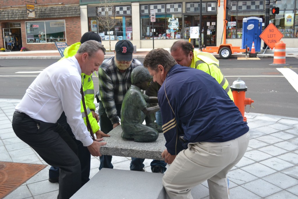 A bronze boy holding a turtle, created by Beverly Benson Seamans, was installed on South Main Street last week as the first piece of public art for the city.