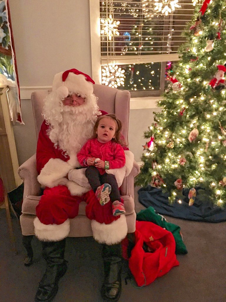 Jon's daughter, Julia, sat (timidly) with Santa at the Feztival of Trees in November, but now that the Feztival is over, you can still catch him at the Steeplegate Mall.