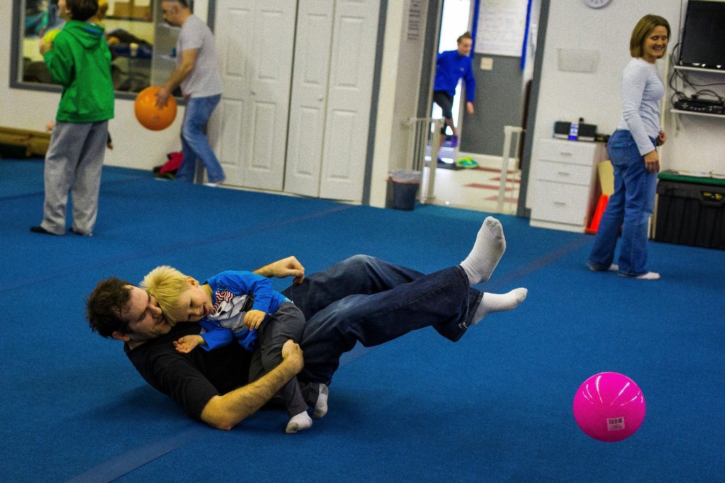 John Fellian of Hopkinton and his 2-year-old son Tobey play at Flipz Gymnastics in Concord in 2015. Right: Braden Bosco, 5, has a whale of a time at Village Idiotz Party Rentals Entertainment Center (the bounce house place) at the Steeplegate Mall last year (photo by Tim Goodwin). If you’re looking for a place to let the kids run around and get all tuckered out, you can’t go wrong with either of these options.