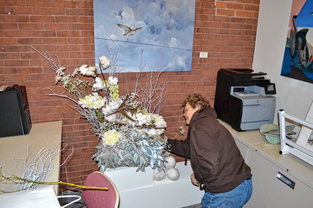 Millie LaFontaine makes some minor tweaks to her arrangement that represented Adelaide Murphy Tyrol’s “Thrush” prior to the opening of Art & Bloom at McGowan Fine Art last week. If you missed the three-day show, never fear, we’ve got pictures for you to check out.