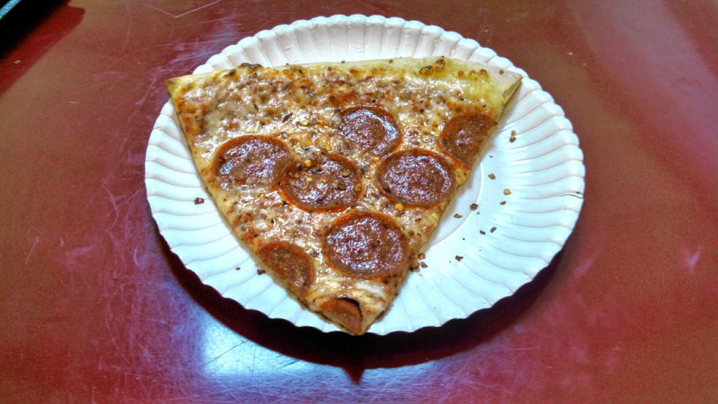 A slice of pepperoni pizza from Basil Pizza & More inside the Steeplegate Mall.