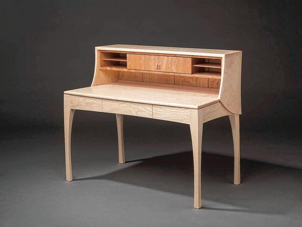 This ash desk by Ted Blachly, made with popcorn figured ash, cherry and white oak, is one of many pieces in the latest League of N.H. Craftsmen exhibit, Setting the Standard, which opens Friday.