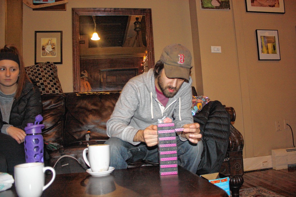 Jon carefully removes a piece from the Donkey Kong Jenga tower at True Brew Barista last week.