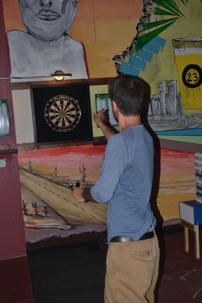 Jon lines up a shot during a darts tournament at Area 23 last Thursday.