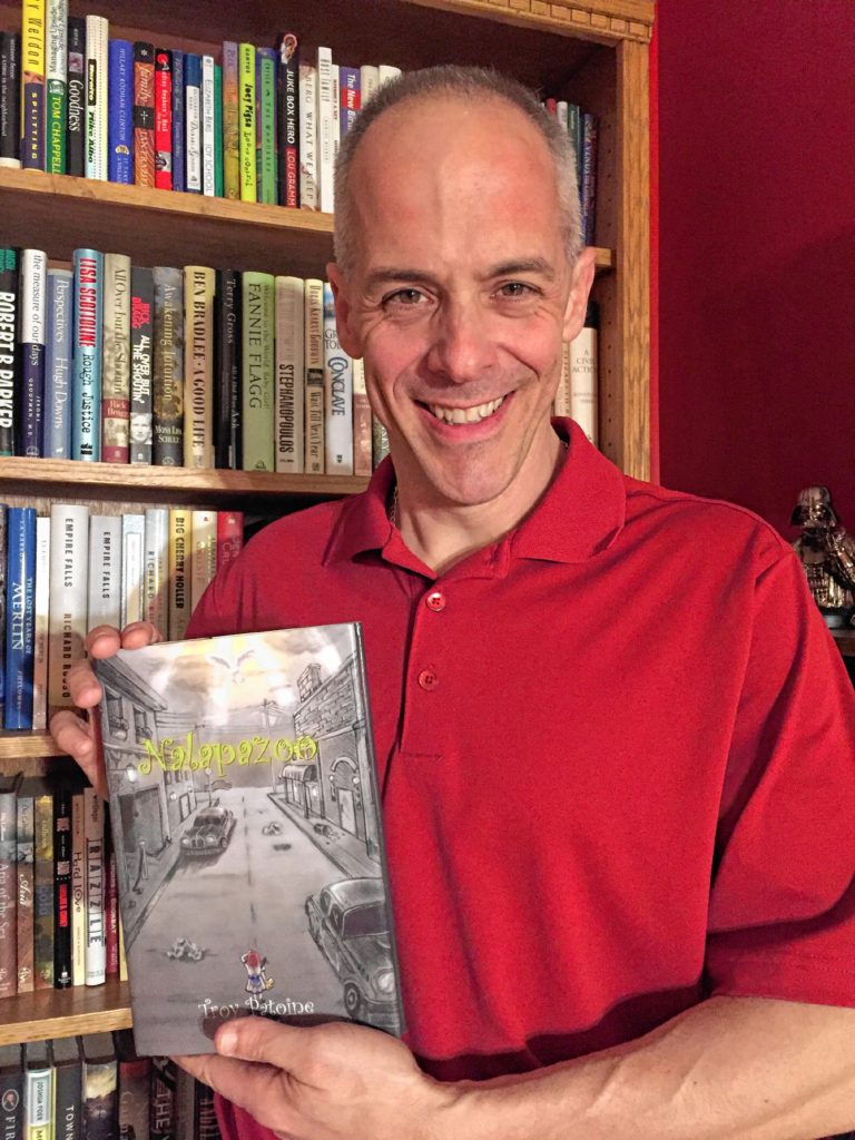 Concord author Troy Patoine holds  a copy of his latest book, Nalapazoo, which is now  available on Amazon.