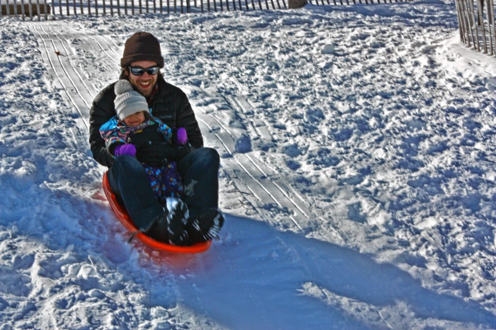 Jon takes his daughter, Julia, sledding for the first time ever at the small hill at White Park last week. Fun was had by all.