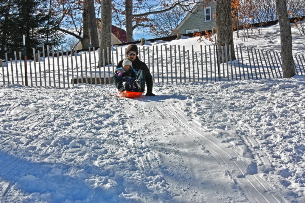 Jon takes his daughter, Julia, down the small hill at White Park last week. She had a blast out there on her first-ever sledding expedition, and so did Jon! (AIMEE LAROCHELLE / For the Insider)