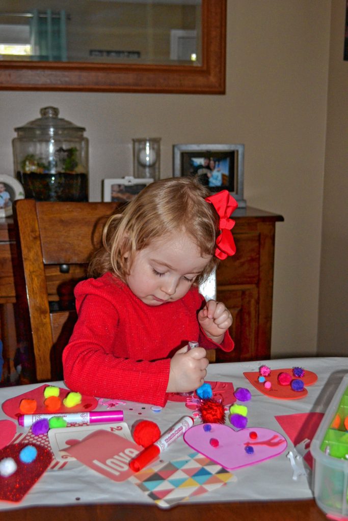 Tim and his daughter, Sophie, make valentines.