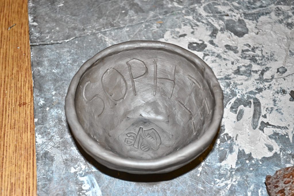 Tim tested his art skills by creating a pinch pot at Rundlett Middle School during Kristi Nyhan's eighth grade class.