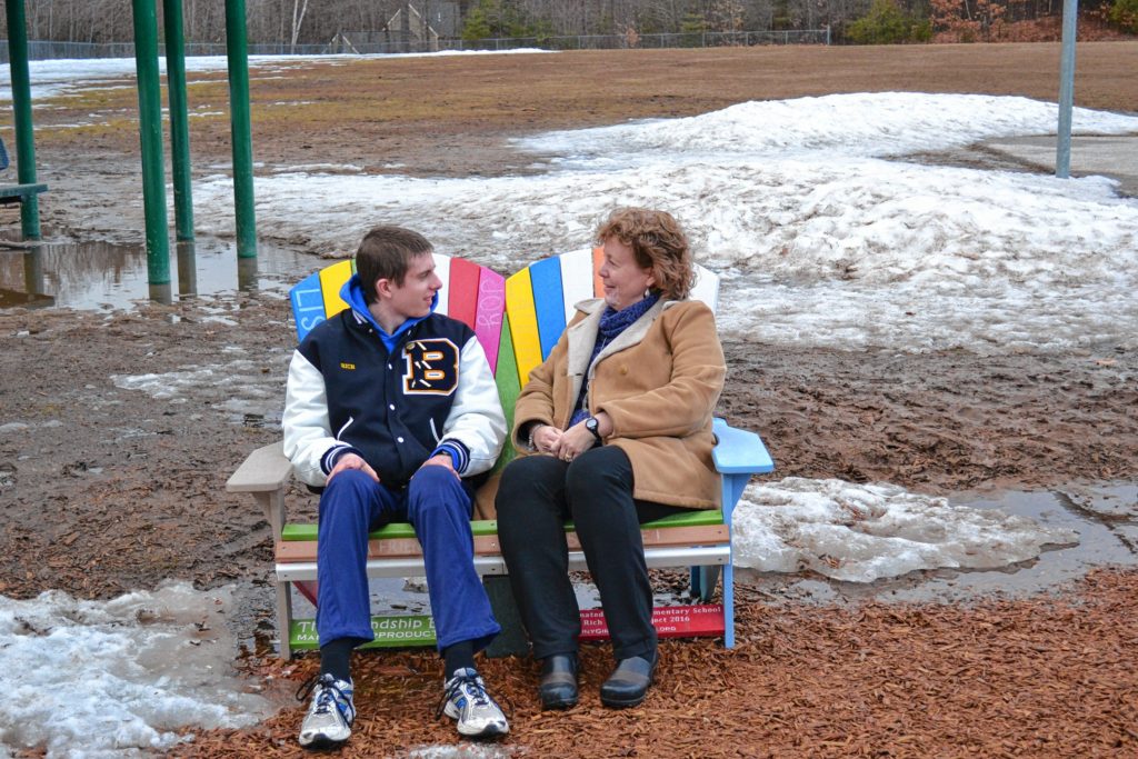 Jack Rich and his mom, Jean, make good use of the friendship bench at Bow Elementary School he bought for his senior project. Next week, seven more schools will get the colorful benches thanks to the Riches’ continued fundraising effort.