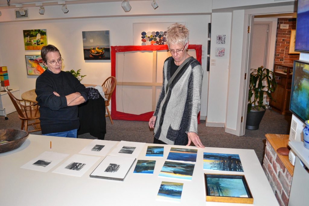 Sarah Chaffee (right), owner of McGowan Fine Art, talks with one of her many artists, Sandy Wadlington, about some of her new work at the gallery last week. Facing page: Orange Ladder by Susan Jaworski Stranc is one of many pieces you’ll find in the latest show. And you should see it in color.