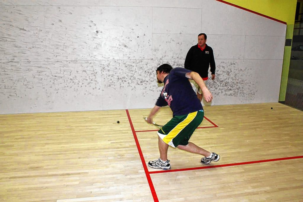Tim got little lesson in how to play squash from St. Paul’s School Coach Chris Smith.