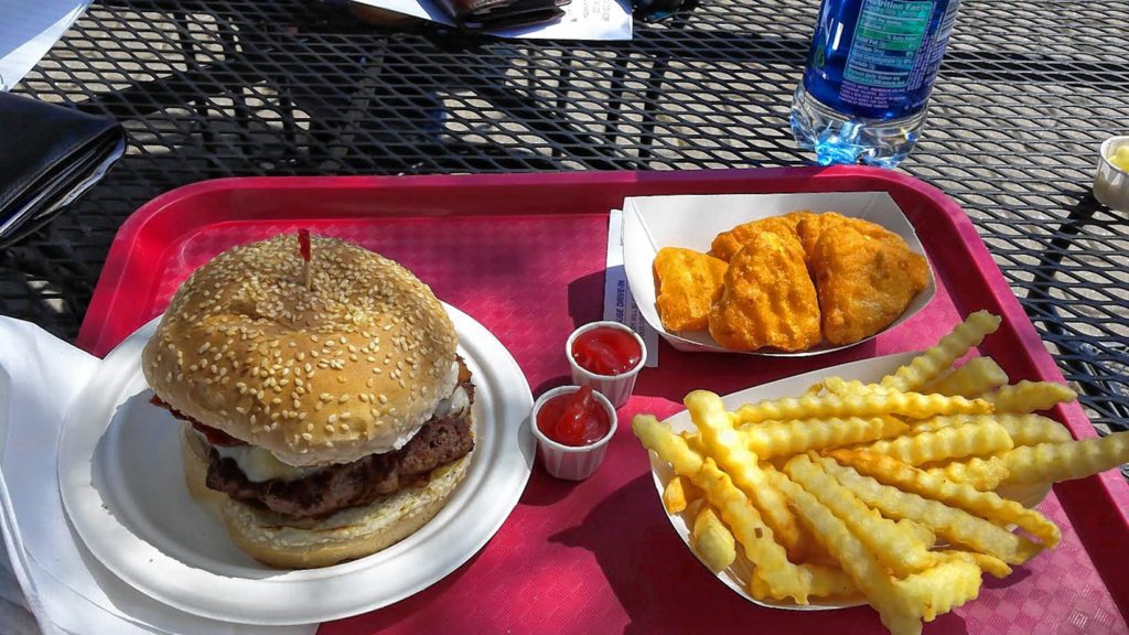 This bacon cheddar burger, fries and mac and cheese bites were found at the Brick House Drive-In.