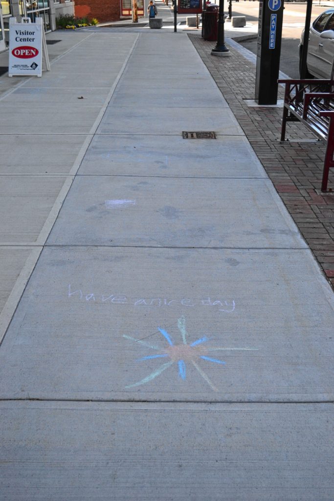 We found this piece of street art on the sidewalk outside of the Smile Building last week and it certainly brightened our day. Tim Goodwin