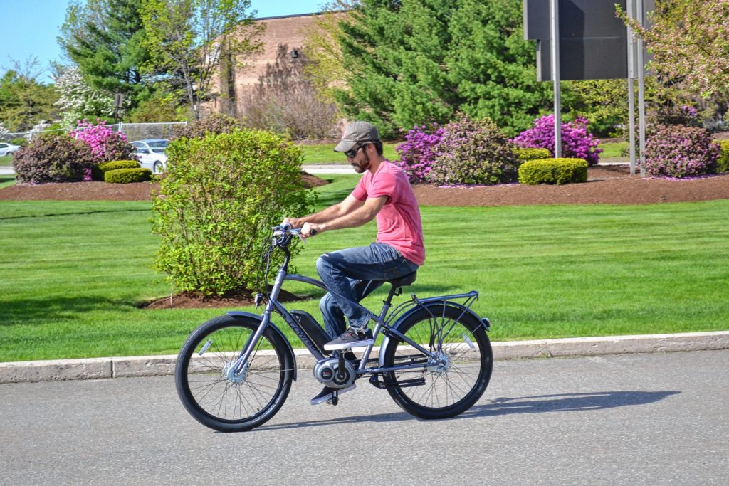 Jon takes the Electra Townie Go! for a spin around the parking lot at Goodale's Bike Shop last week. His first time ever riding an electric motorized bike was a thrilling one. TIM GOODWIN / Insider staff