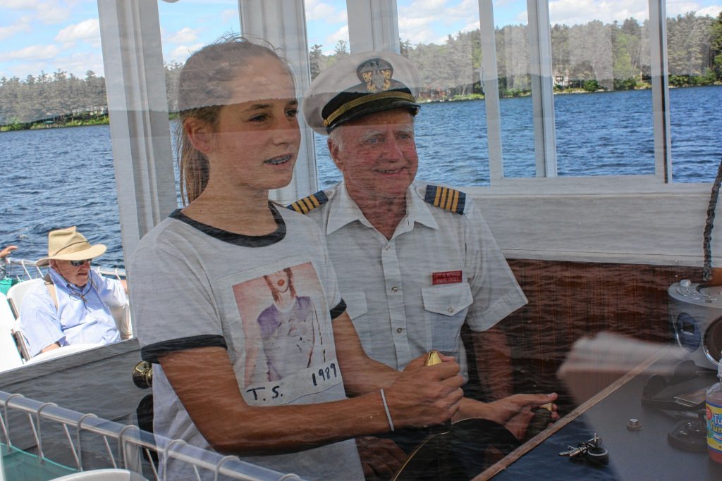 M.V. Mt. Sunapee II Capt. Al Peterson lets Olivia Dorion, 12, of California drive the ship for a little bit. The vessel didn't crash or sink, so we say Olivia did quite a nice job.  JON BODELL / Insider staff