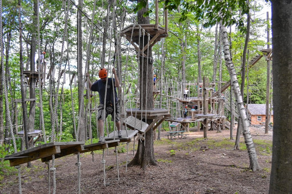 Tim took a spin around the aerial challenge course at Mount Sunapee's adventure park. MEGAN BURCH / For the Insider