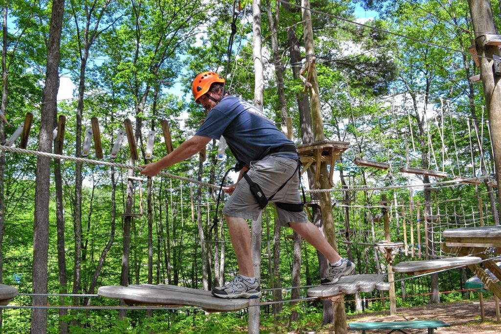 Tim took a spin around the aerial challenge course at Mount Sunapee's adventure park. MEGAN BURCH / For the Insider