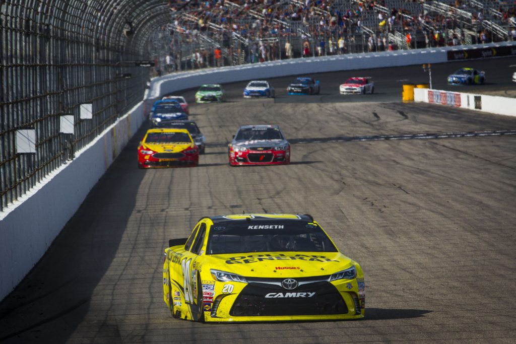 Matt Kenseth (20) maintains a lead as Joey Logano (22) and Tony Stewart (14) fight for second place in the final laps of Sundayâs NASCAR Sprint Cup Series New Hampshire 301 auto race at New Hampshire Motor Speedway in Loudon, July 17, 2016. (ELIZABETH FRANTZ / Monitor staff) Elizabeth Frantz