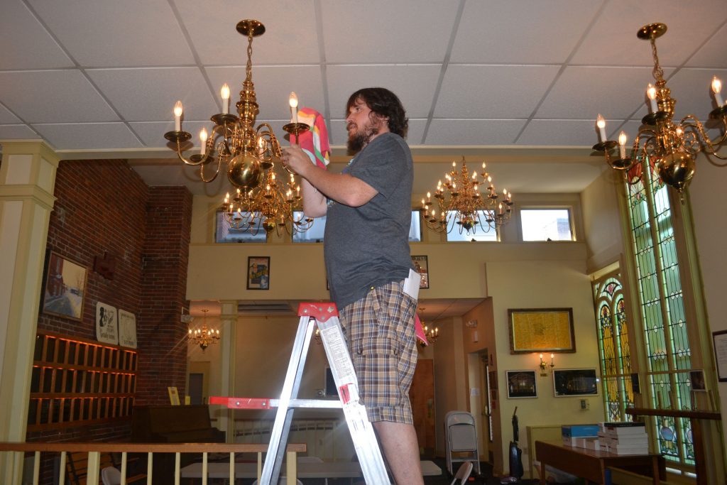 Tim decided to do his part, so he volunteered at the Friends of the Audi's 26th annual Pitch In and dusted some chandeliers. Tim Goodwin
