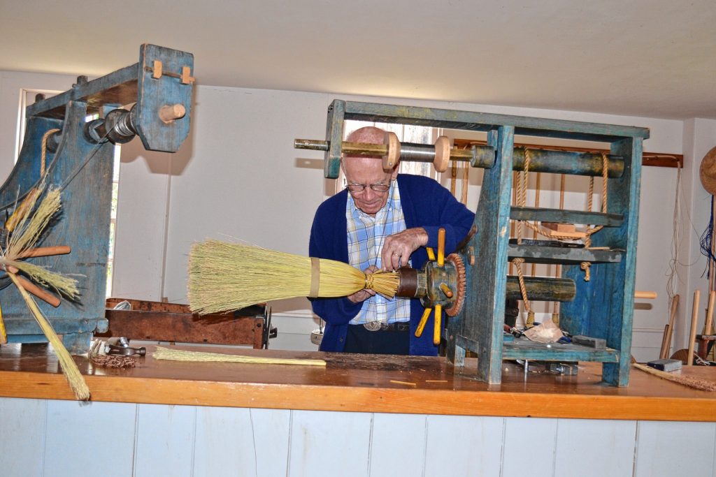 Joe Rogers does his broom making demonstration during a tour of Canterbury Shaker Village. Tim Goodwin / Insider staff