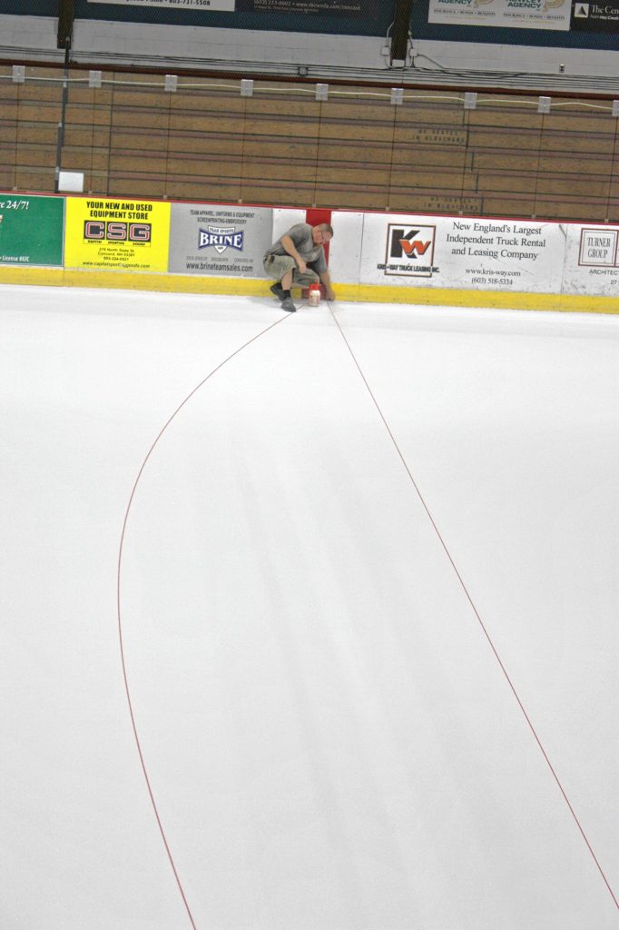 Brent Beyor (wearing hat) and Mike South (in shorts and a T-shirt) had their work cut out for them at Everett Arena last Thursday. One of the true signs of the end of summer is when the arena transitions from an event space back to a hockey rink, and there's a lot of work that goes into it. We watched as the guys sprayed water, ran yarn from one side of the rink to the other, took lots of measurements, traced some shapes and painted the ice to get it ready for skating, which began Monday. JON BODELL / Insider staff