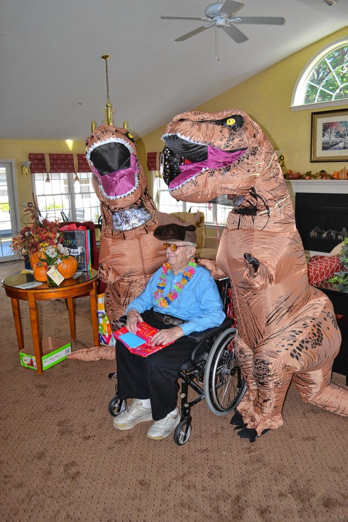 Jim Palmquist, a resident at Havenwood, turned 100 years old last week and celebrated with ice cream, cookies, present, wacky hats and a couple dinosaurs. TIM GOODWIN / Insider staff