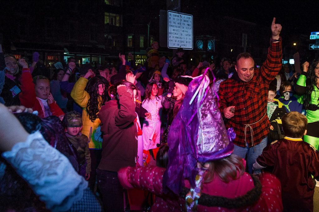DJ Nazzy (right) leads a dance party during the annual Downtown Halloween Howl on Main Street in Concord on Friday, Oct. 24, 2014.  (ELIZABETH FRANTZ / Monitor staff) ELIZABETH FRANTZ