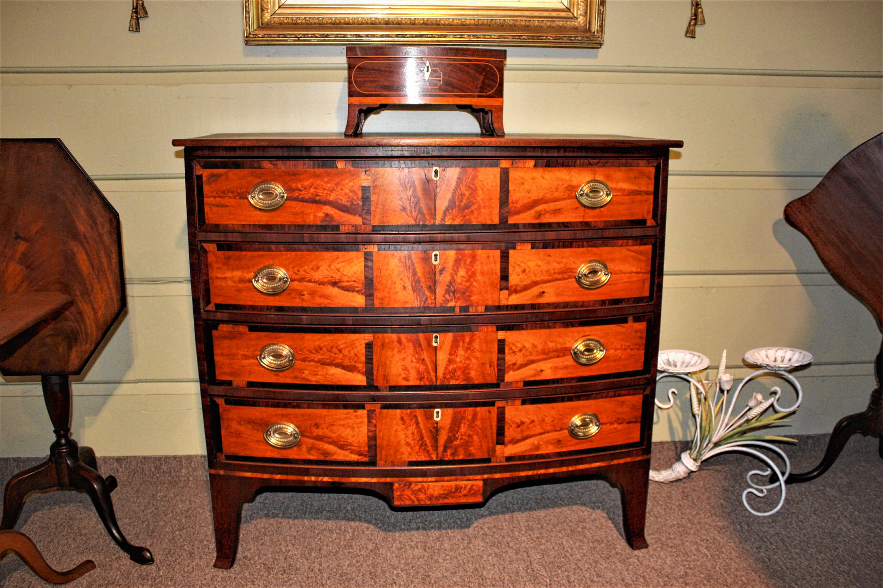 Gary F. Yeaton Antiques has this antique bowfront desk with a 12panel