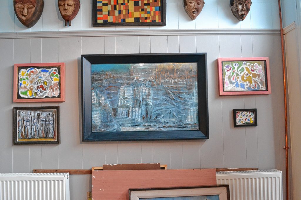 Works by Dave Wiggins and Doug Prescott hanging in the 3 Pleasant St. studio they share. TIM GOODWIN / Insider staff