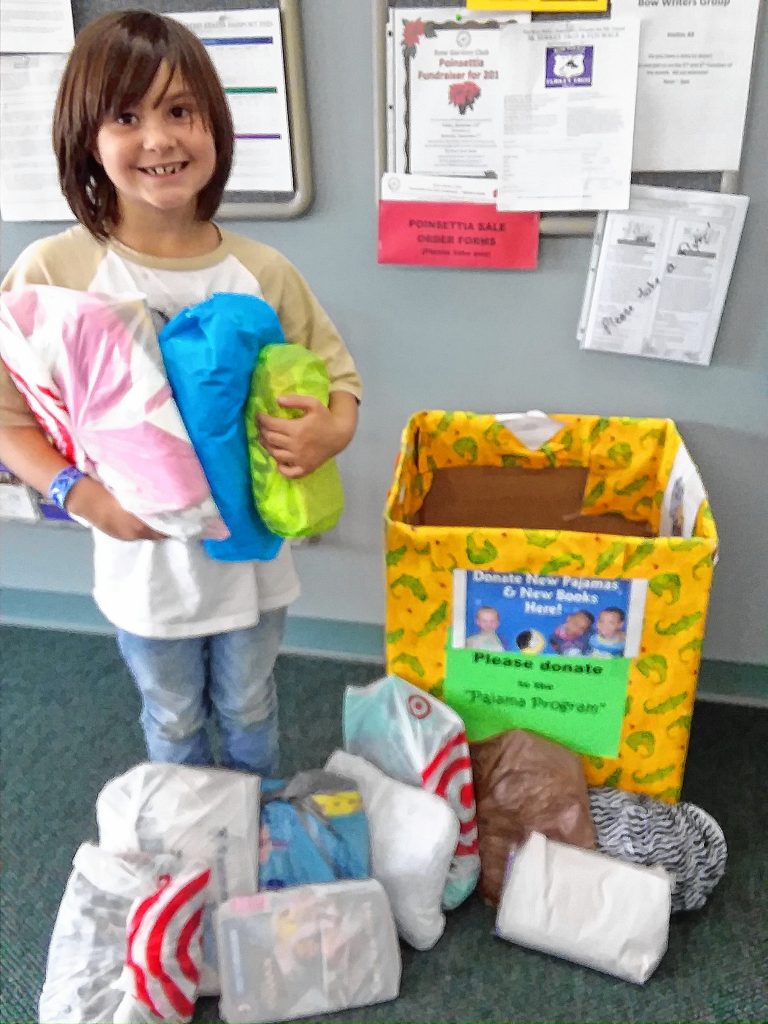 Julianna Cusson of Bow donated a dozen books and pajamas to the Bow Garden Club's pajama project, which she received instead of presents at her eighth birthday party. Courtesy