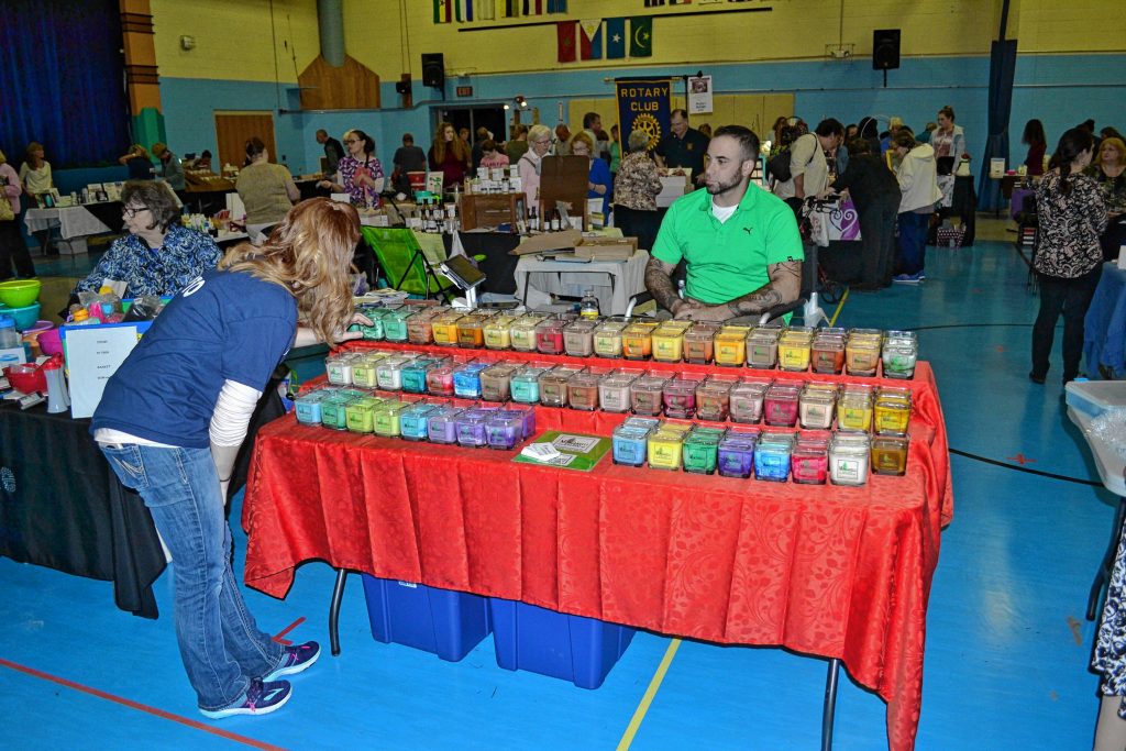Sara Washburn looks over the selection of Mingarelli Soy Wax Candles at the One Stop Shop extravaganza at Beaver Meadow last week. TIM GOODWIN / Insider staff