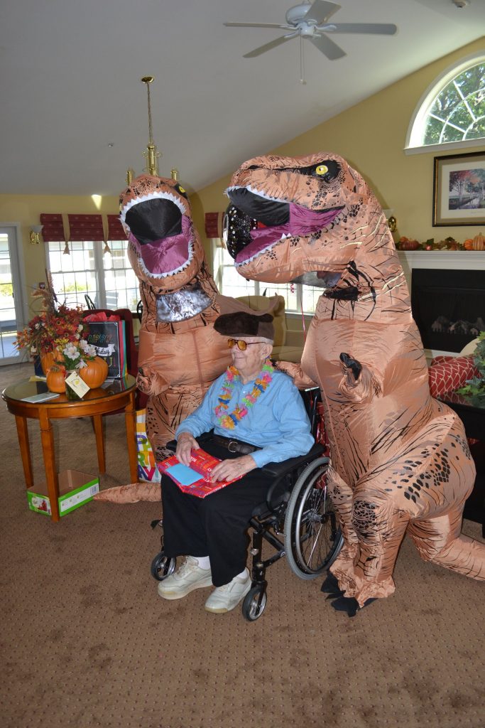 Jim Palmquist, a resident at Havenwood, turned 100 years old last week and celebrated with ice cream, cookies, present, wacky hats and a couple dinosaurs. TIM GOODWIN / Insider staff