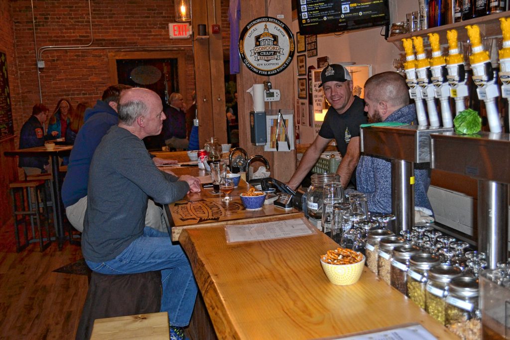 Concord Craft Brewing's Scott Zipke (far) and Andrew Johnson talk to customers Bruce Dyke and Shaun Clougherty during tap room hours last week. TIM GOODWIN / Insider staff