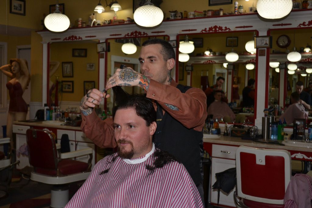 Tim got rid of what equated to an adult-inspired bowl cut and has a brand-new look thanks to Lucky's Barbershop's owner Josh Craggy. Courtesy