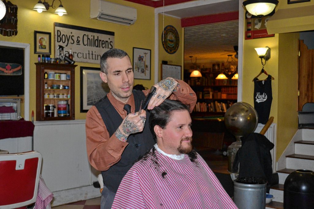 Tim got rid of what equated to an adult-inspired bowl cut and has a brand-new look thanks to Lucky's Barbershop's owner Josh Craggy. Courtesy