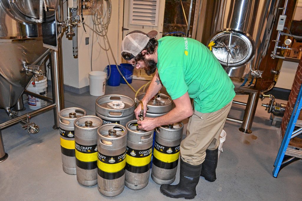 Sometimes you just have to fill smaller kegs from bigger kegs when you work at Concord Craft Brewing Co. TIM GOODWIN / Insider staff