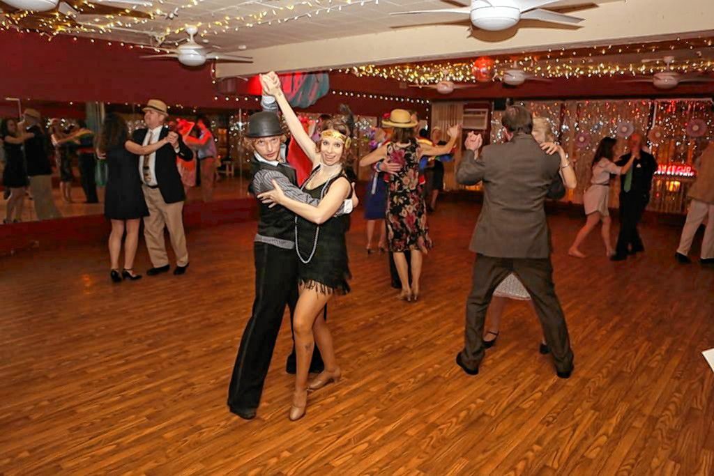 You can really cut a rug this New Year's Eve at Let's Dance Studio -- just like this fine couple here -- during The Midnight Carnival: A Formal Masquerade. Courtesy of Let's Dance Studio