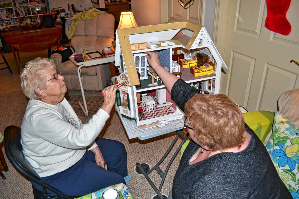 Mother and daughter, Rae Edmunds and Lonna Abbott, have been building dollhouses together for many years and are currently working on a replica of Edmunds's childhood home on Mountain Road. TIM GOODWIN / Insider staff