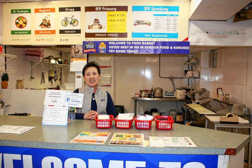 Helen Han stands behind the food counter at Go Food Basket on Washington Street last week. The Asian grocery store also serves up authentic Korean food, including its famous kimchi made fresh by Han right there in the store. JON BODELL / Insider staff