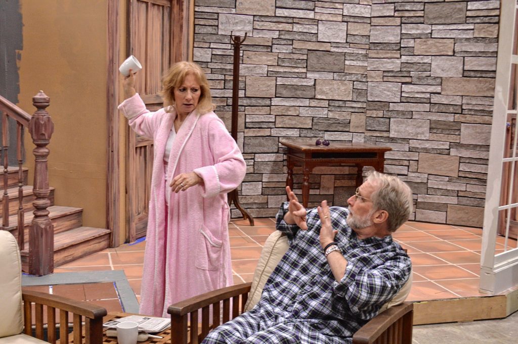 Kim Lajoie, as Sonia, smashes a coffee cup as Steve Lajoie (as her brother, Vanya and husband in real life) during a recent rehearsal for the Community Players of Concord's production of Vanya and Sonia and Masha and Spike. TIM GOODWIN / Insider staff