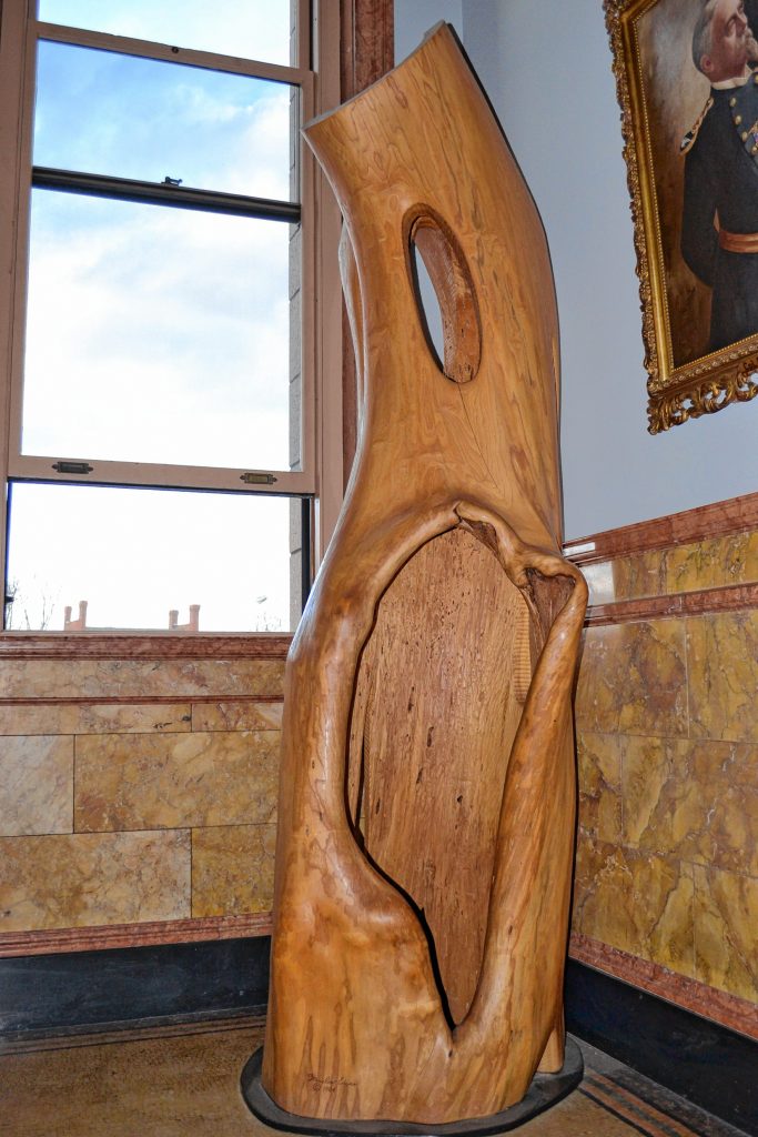 This state building is where one might go to find out about family history or merely check out the daily newspaper. This sculpture was crafted from New Hampshire's oldest elm tree, which happened to grow just down the road in Northwood. TIM GOODWIN / Insider staff